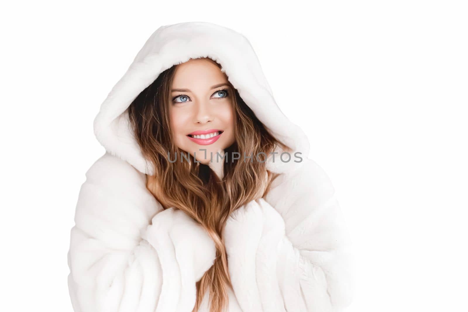 Winter fashion and beauty, beautiful woman in white fur coat.