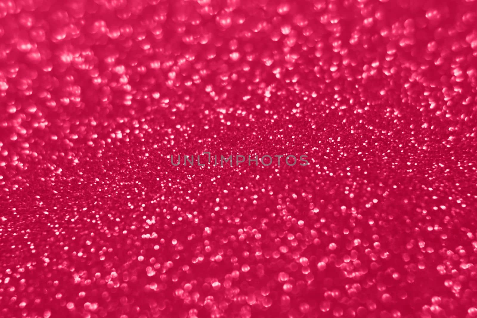 Viva Magenta lights bokeh background, Chrismas lights bokeh. Viva Magenta abstract background. Blurred and glowing lights. Viva Magenta bokeh lens effect from lighting spots. High quality photo