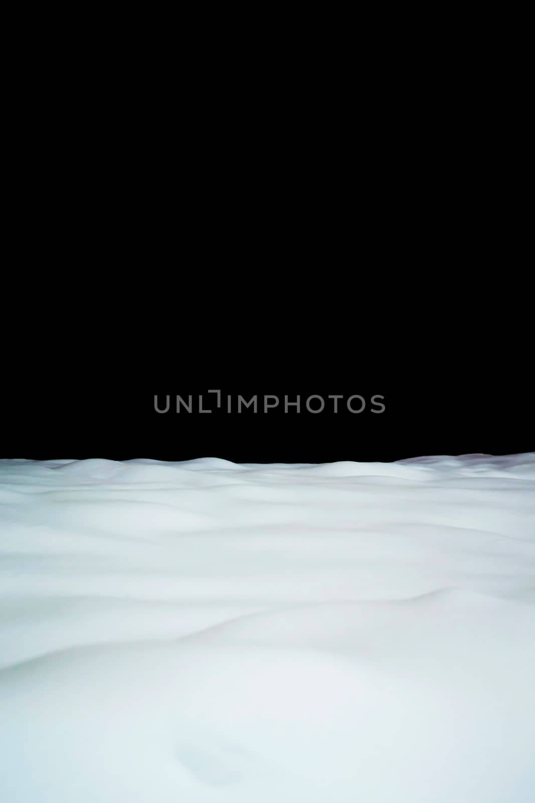 Winter snow background at the bottom and black copyspace at the top. Blank for design