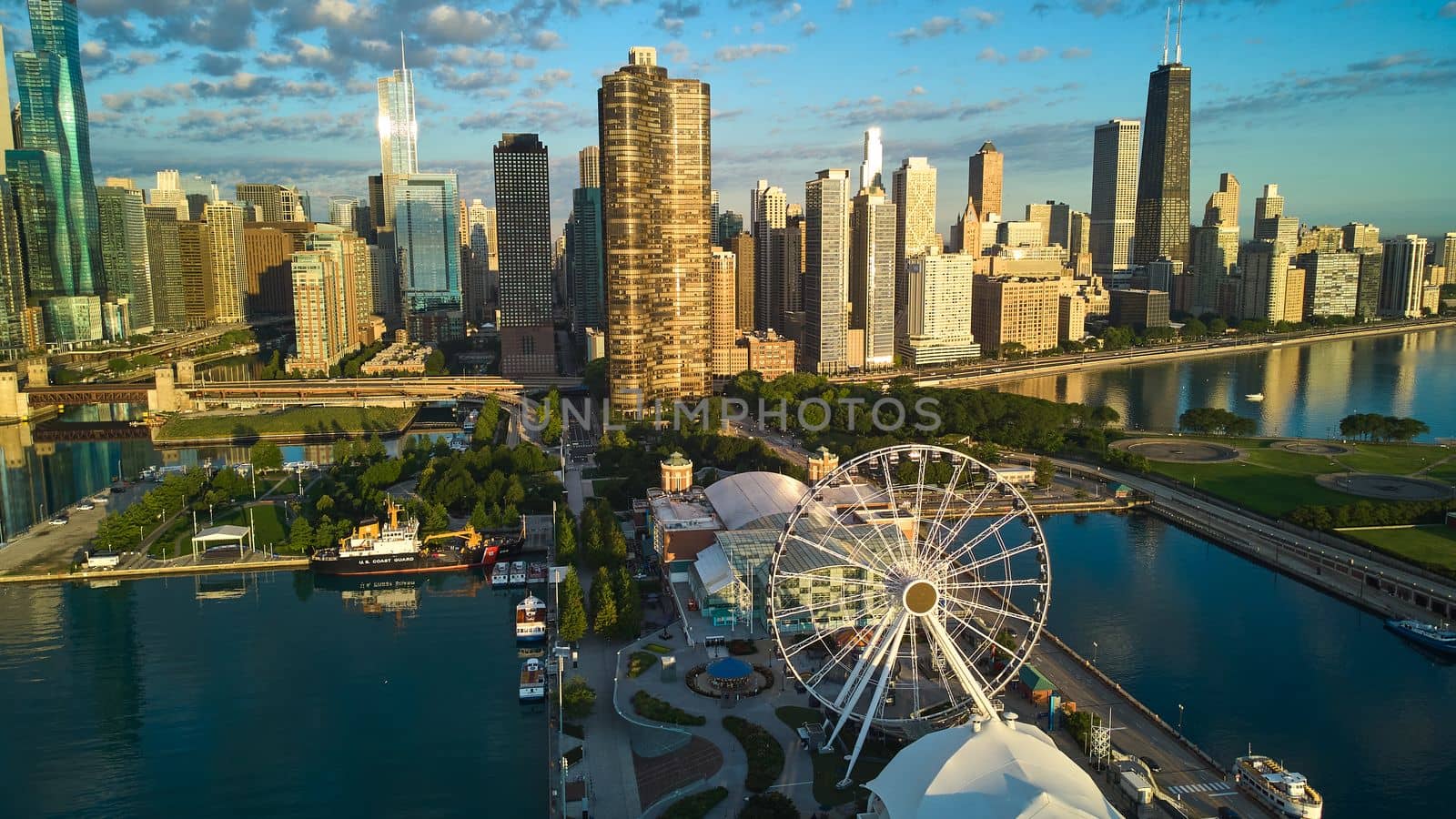 Image of Chicago ferris wheel on Navy Pier next to stunning skyline in morning light