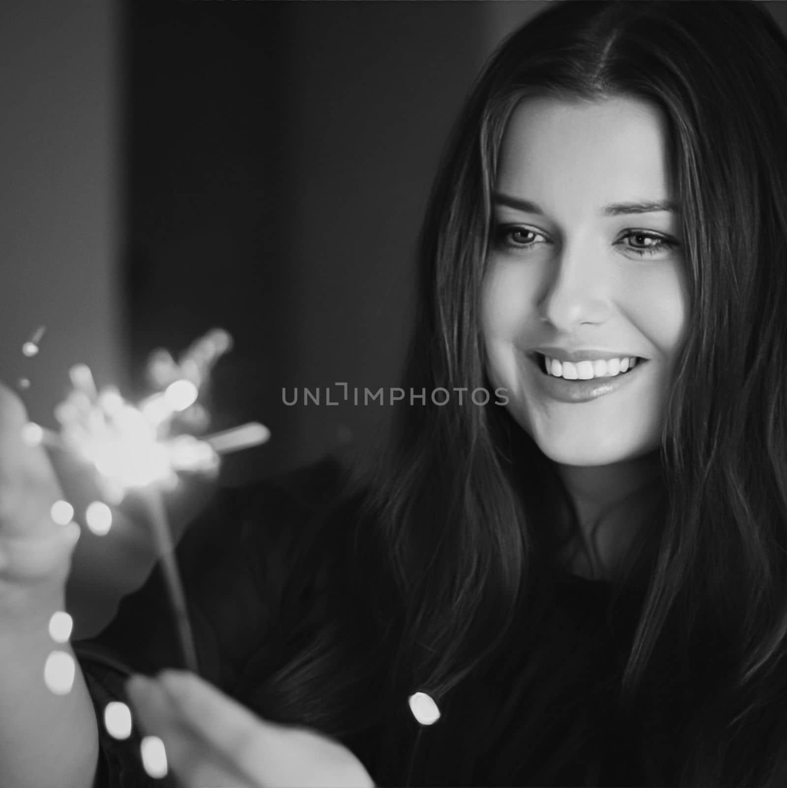 Holiday magic, Christmas and New Year celebration, happy woman with sparklers, portrait