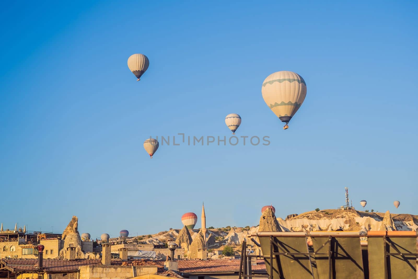 Colorful hot air balloon flying over Cappadocia, Turkey by galitskaya