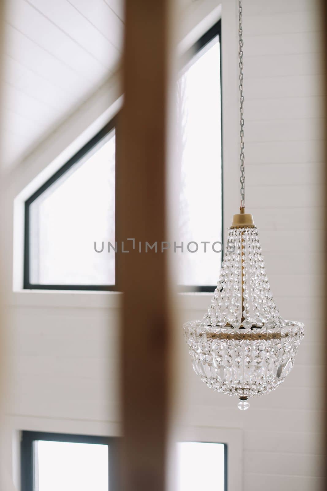 beautiful vintage crystal chandelier in light a room.
