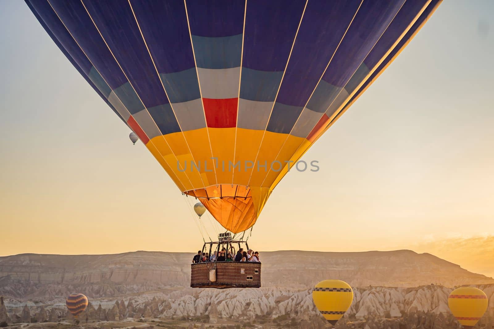 Colorful hot air balloon flying over Cappadocia, Turkey.