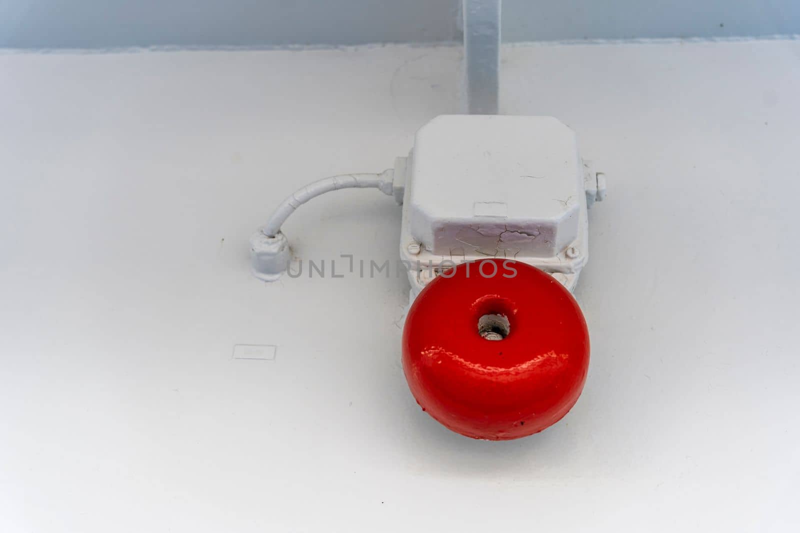 an alarm call on a sea vessel. alarm system installed on the ship, serves to provide a danger sign. alarm systems, Classic vintage alarm bell on the wall of ship. Old red fire bell on the wall