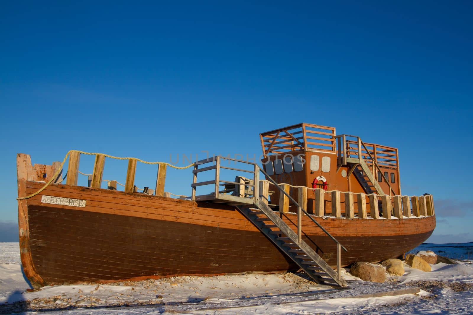 Dutch vessel, the Enterprise, a wooden boat out of the water and turned into a public tourist attraction on the Hudson Bay shore in Churchill, Manitoba, Canada