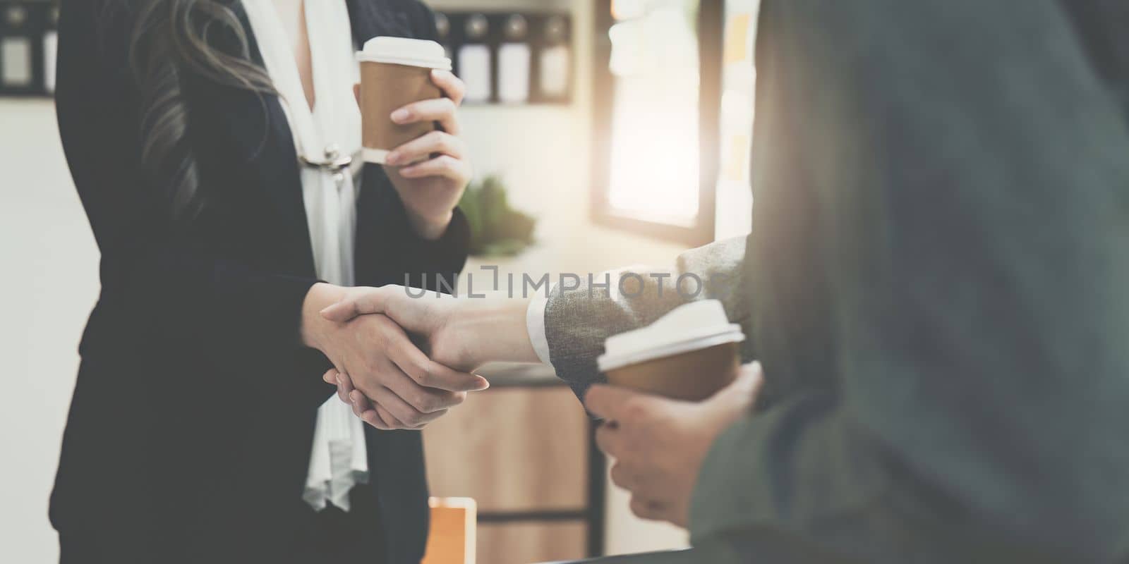 Business people handshake with business partners. Successful business concept. shaking hand after deal concept by itchaznong