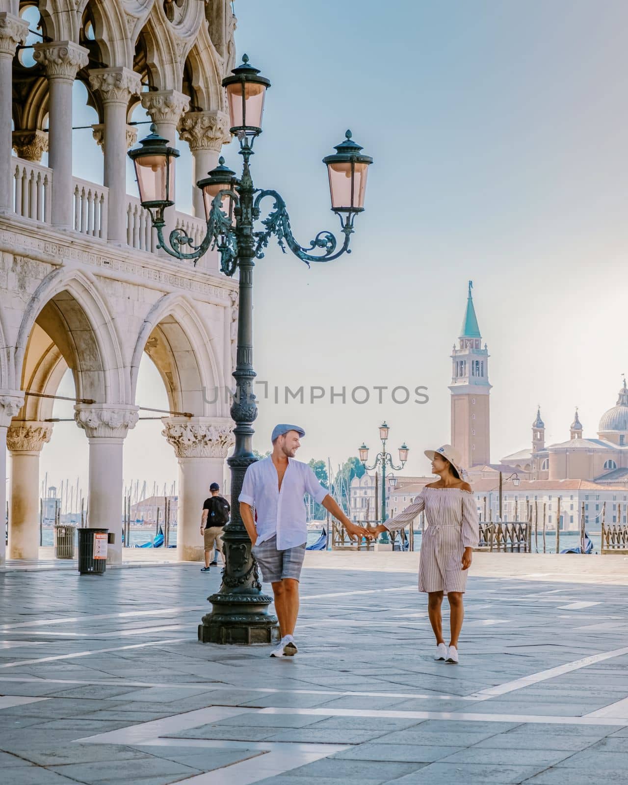 couple on a city trip in Venice, view of piazza San Marco, Venice, Italy by fokkebok