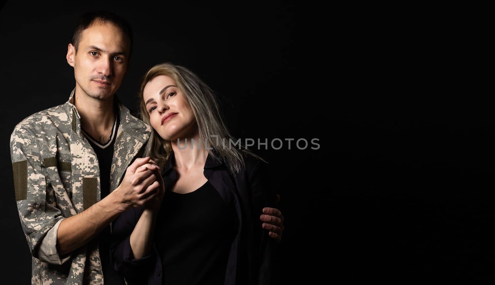 military man and his wife on a black background by Andelov13