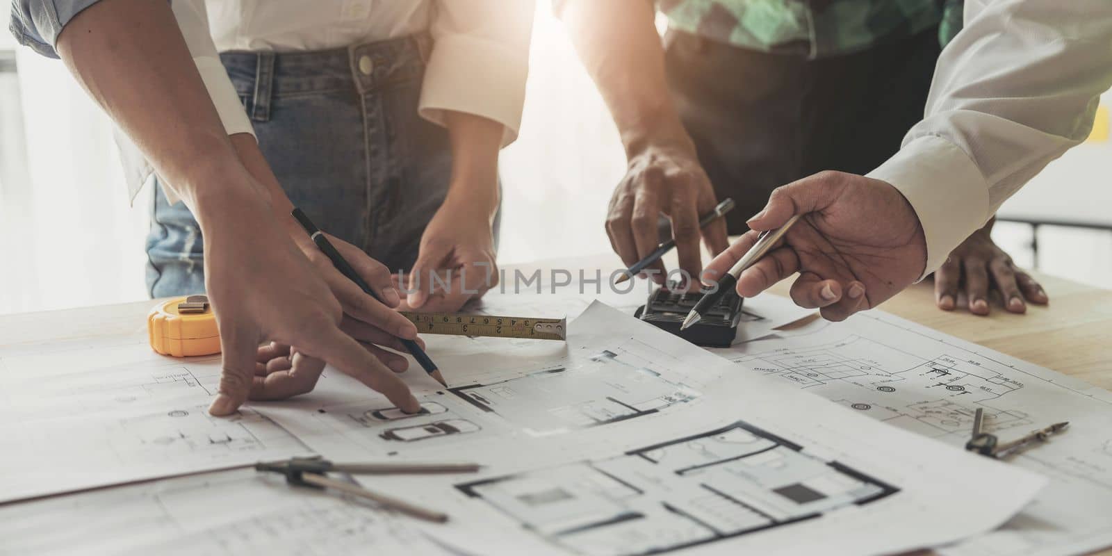 Engineer Teamwork Meeting, Drawing working on blueprint meeting for project working with partner on model building and engineering tools in working site, Construction and structure concept.. by wichayada