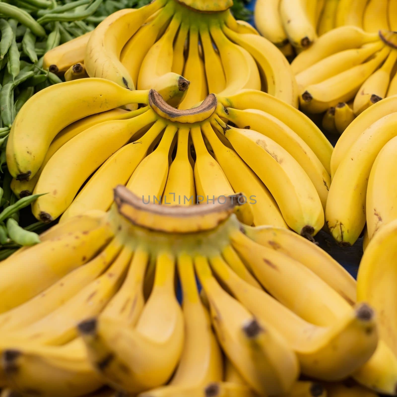 Bunch of ripened bananas at grocery store by koldunov