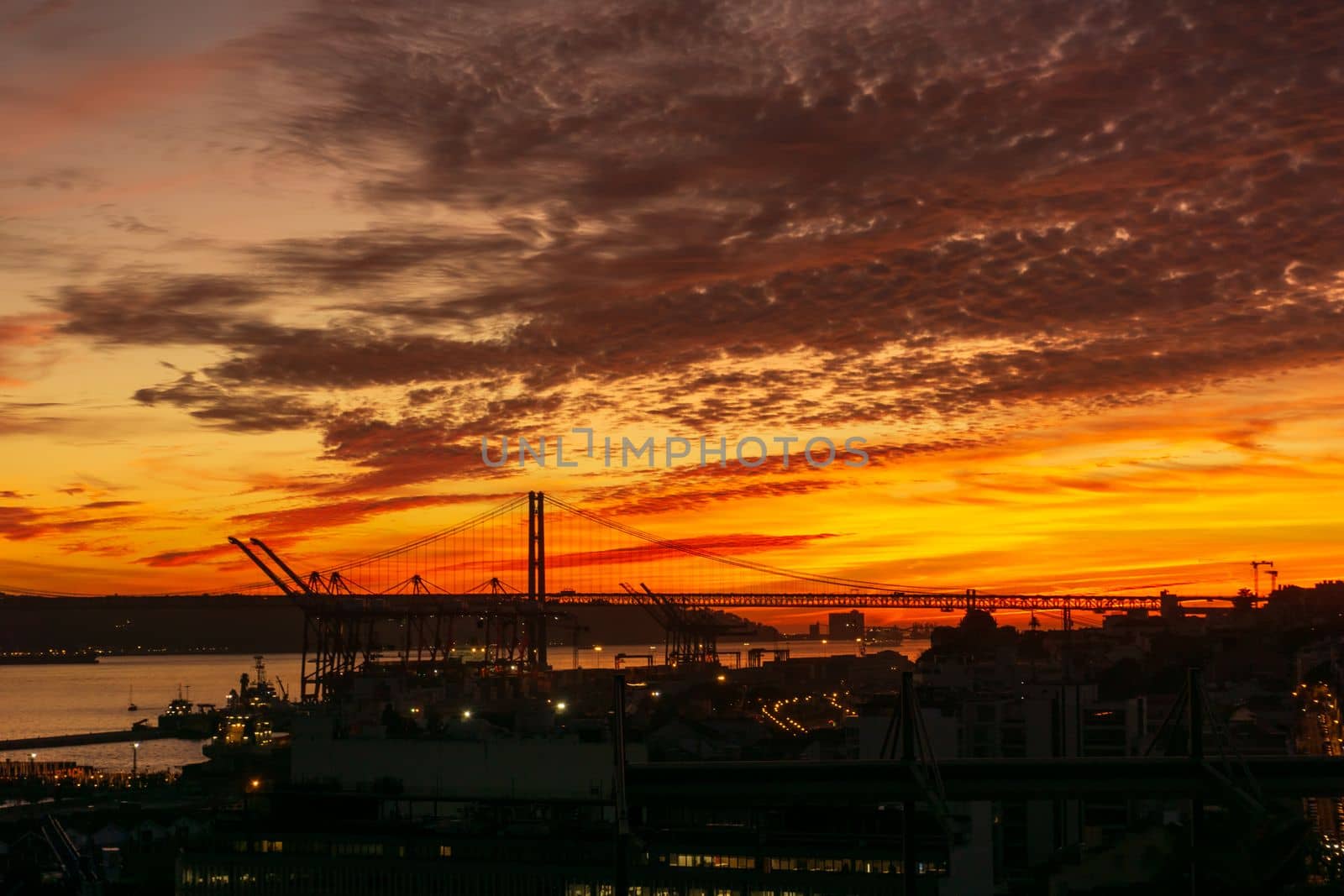 Bright orange sunset over Lisbon, Portugal