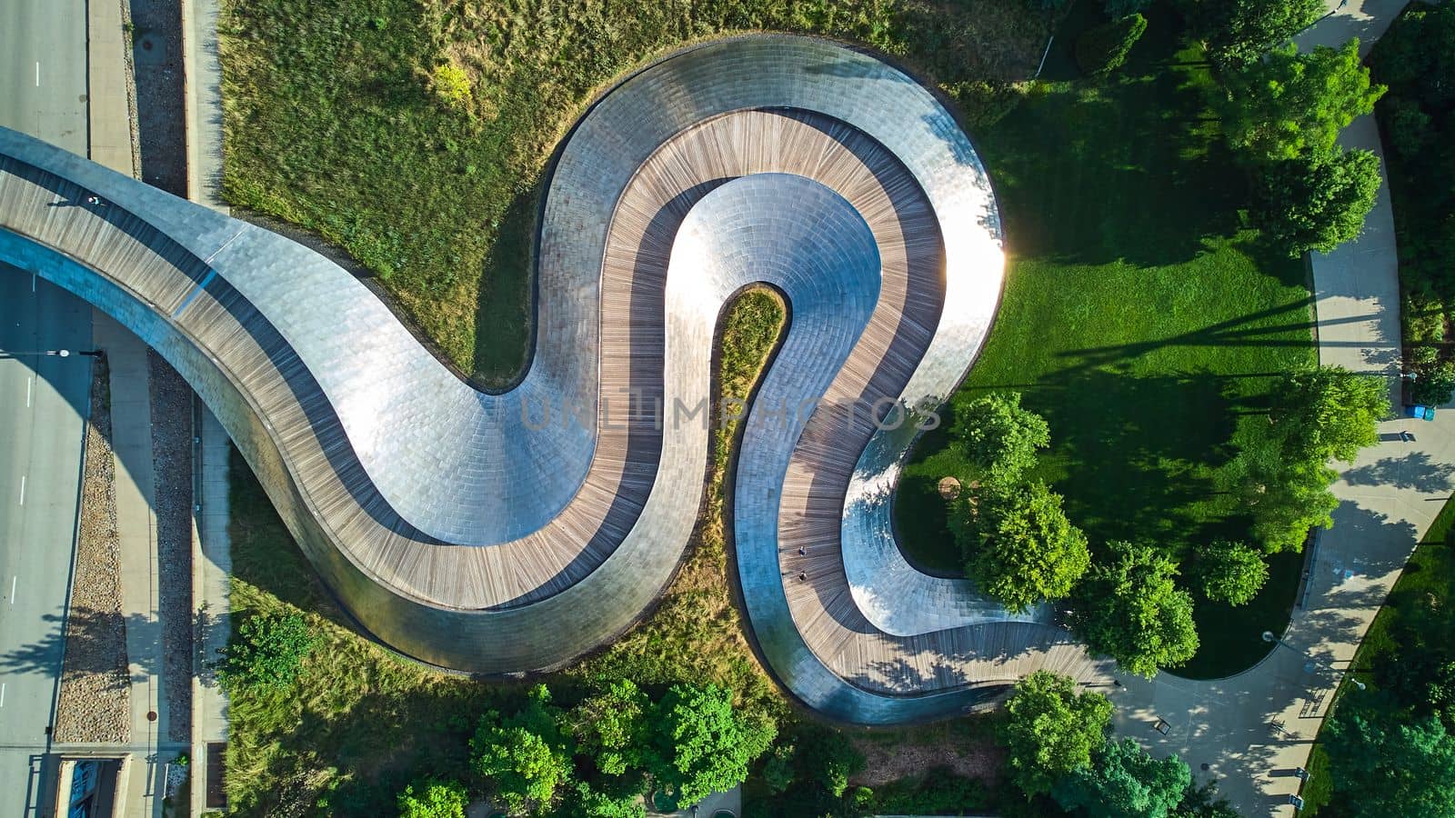 Image of Wavy snake metal path of Pedestrian bridge from above at Millennium Park in Chicago
