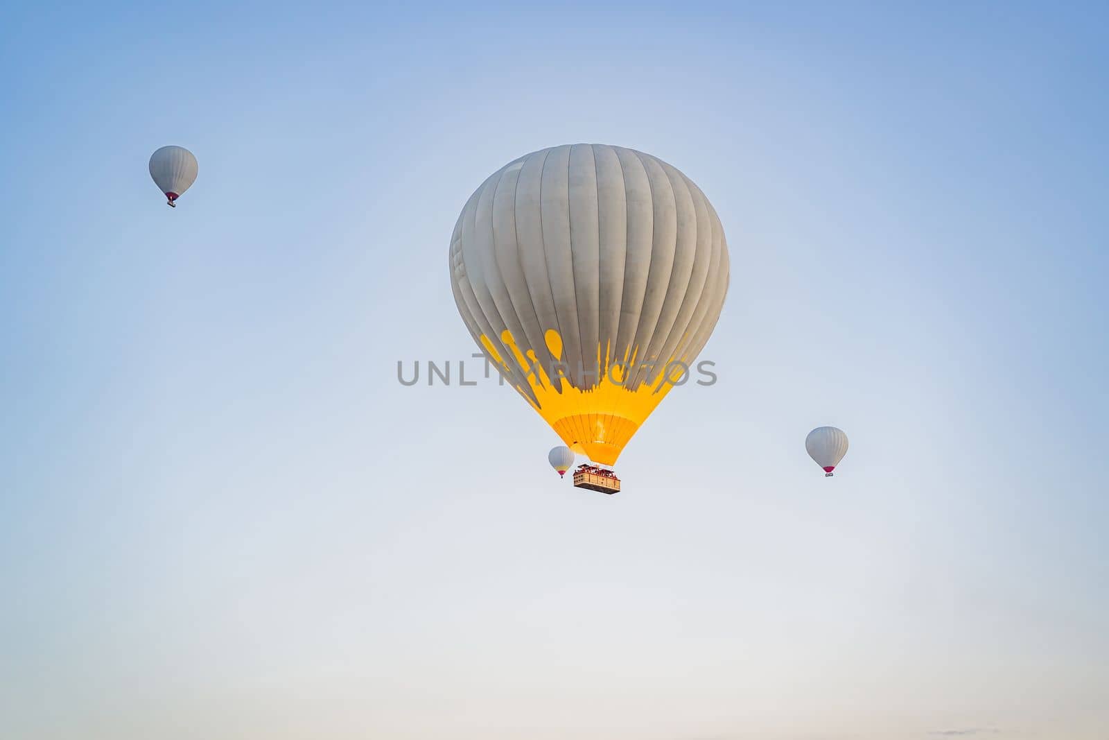 Beautiful hot air balloons over blue sky.