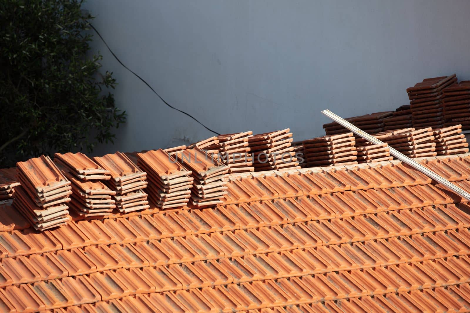 Construction Worker Tile Roofing Repair sunny day by senkaya