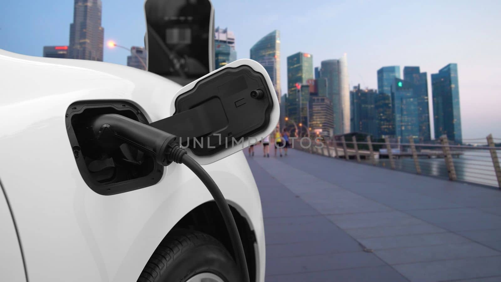 Progressive EV car charging battery from charging point in city area with people by biancoblue