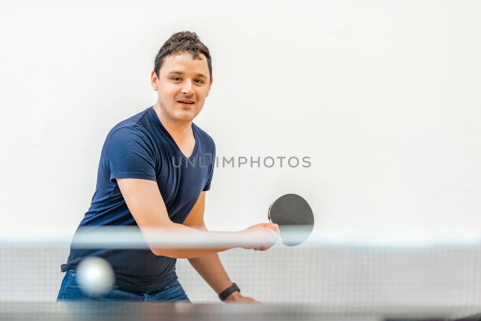 man plays table tennis. copy space. 