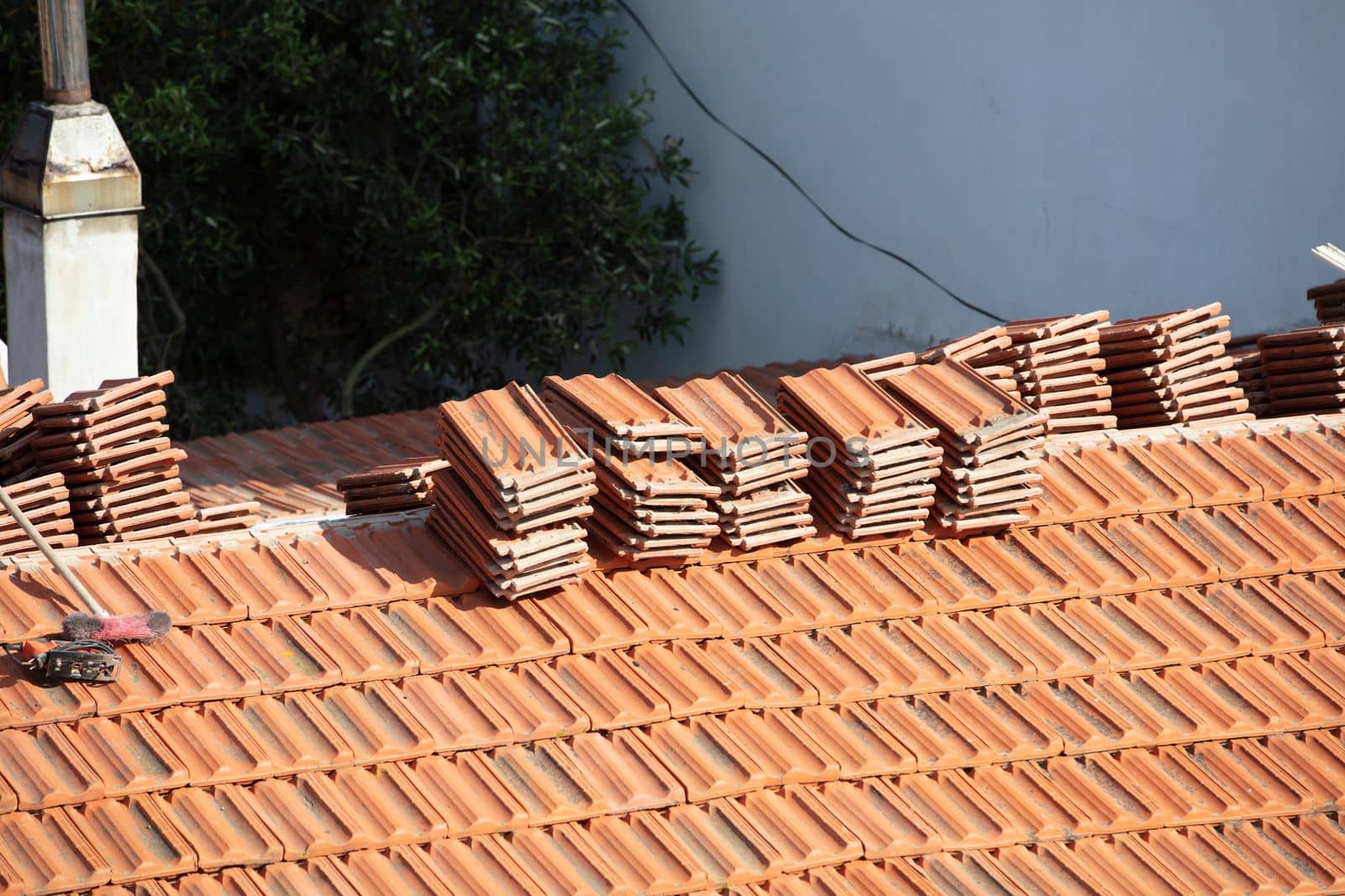 Construction Worker Tile Roofing Repair sunny day by senkaya