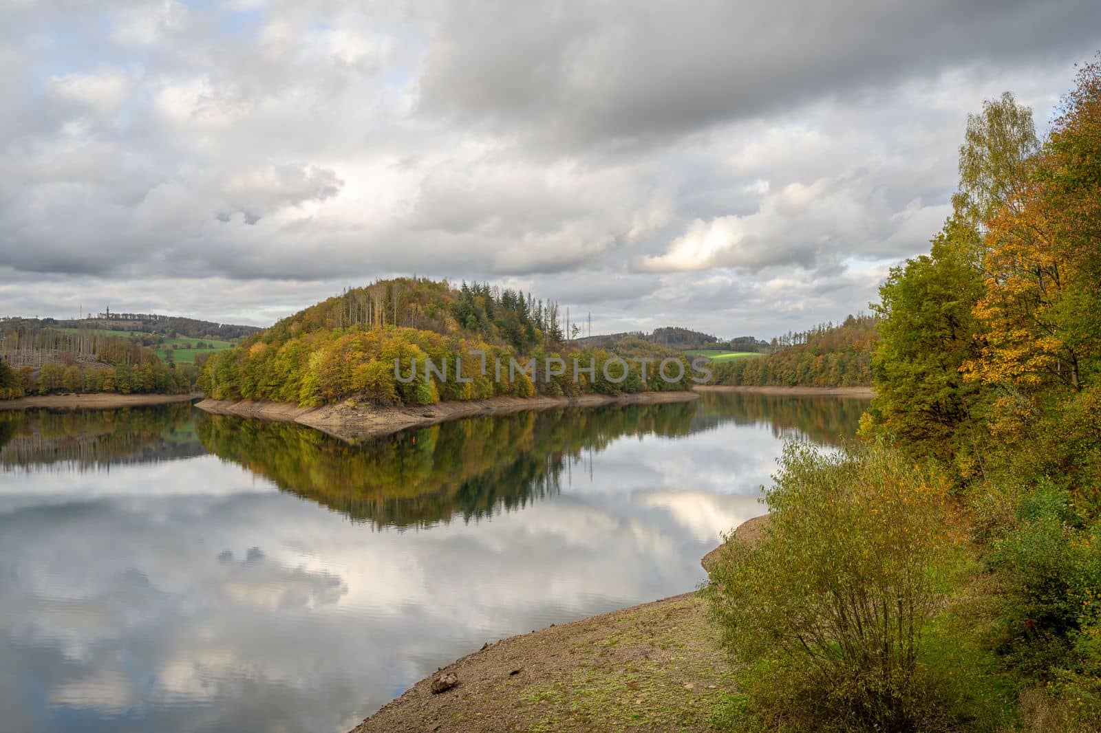 Panoramic image of Agger lake close to Gummersbach in evening light during autumn, Bergisches Land, Germany