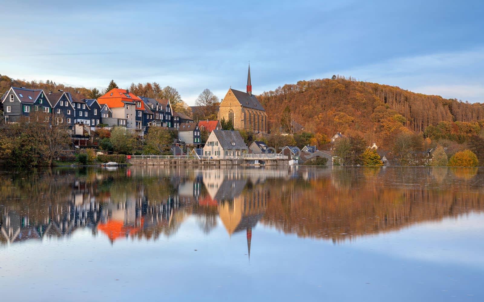 Panoramic image of Beyenburg lake with water reflection and autumnal colors, Wuppertal, Bergisches Land, Germany