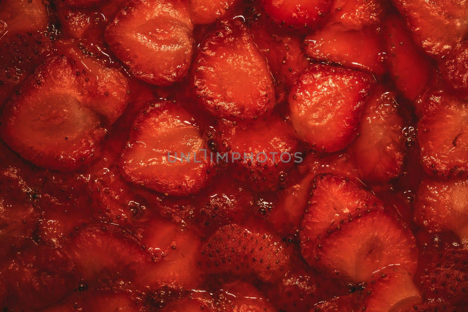 Close-up of Strawberry slices in the fresh jam on fresh strawberry pie