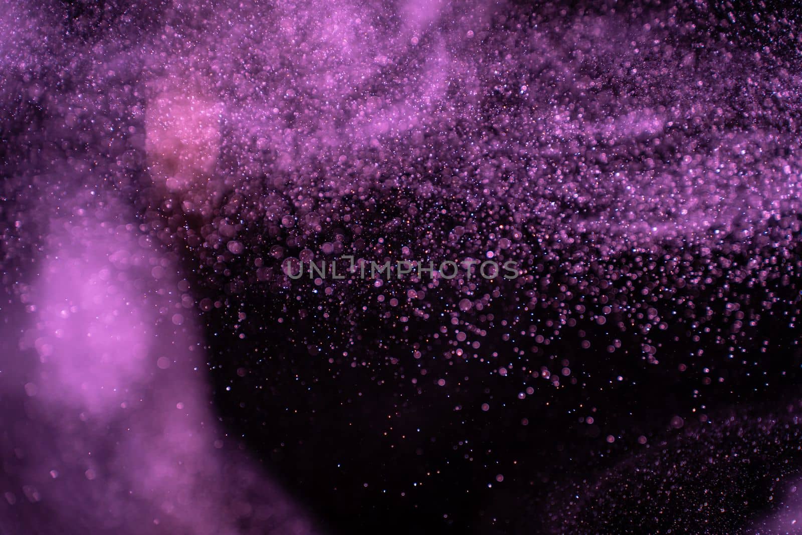 Abstract real dust particles on black background. Glittering sparkling bokeh overlay design with copy space for text. High quality photo