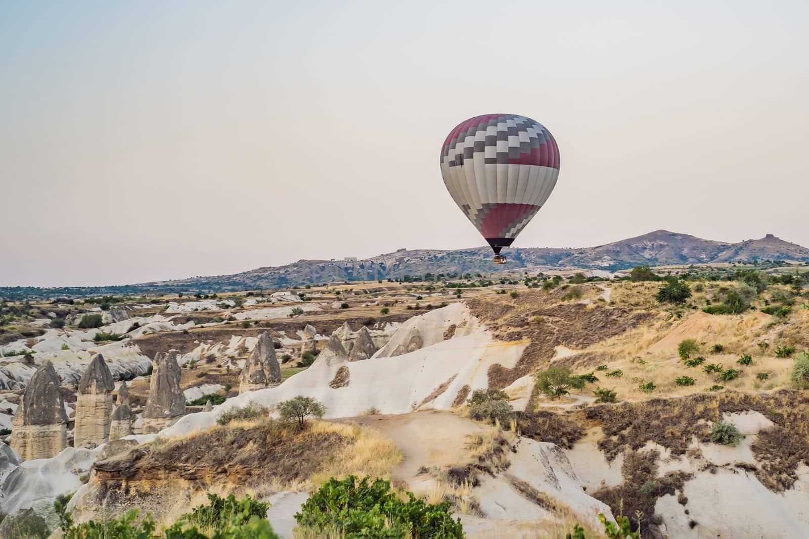 Colorful hot air balloon flying over Cappadocia, Turkey.