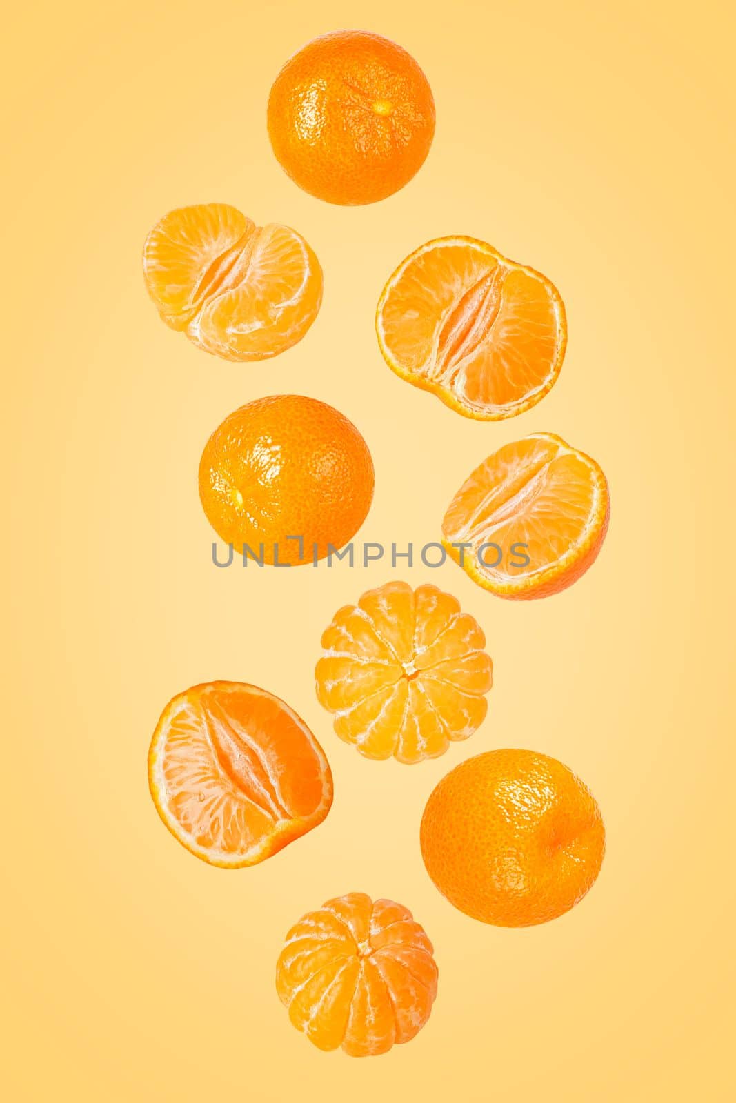 Isolated flying grapes. Nine whole and sliced mandarin fruits falling on white with clipping path as package design element and advertising. Full depth of field.