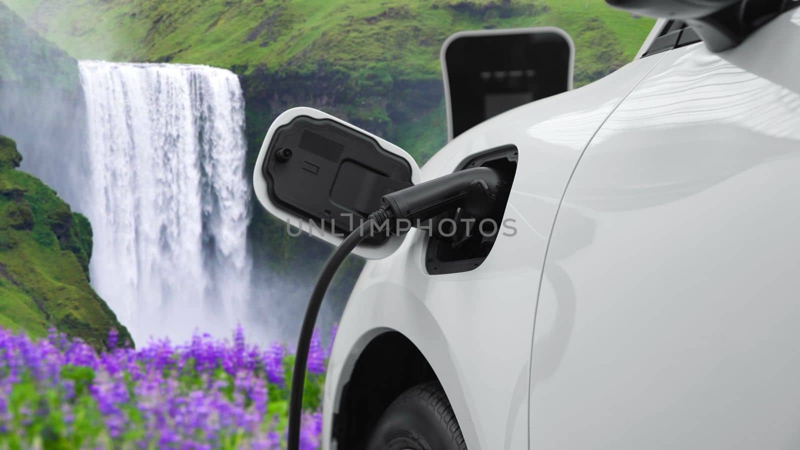 Electric car charging energy from charging station in the natural scenery, waterfall and stream background. Progressive concept of energy sustainability by EV car powered by renewable energy.