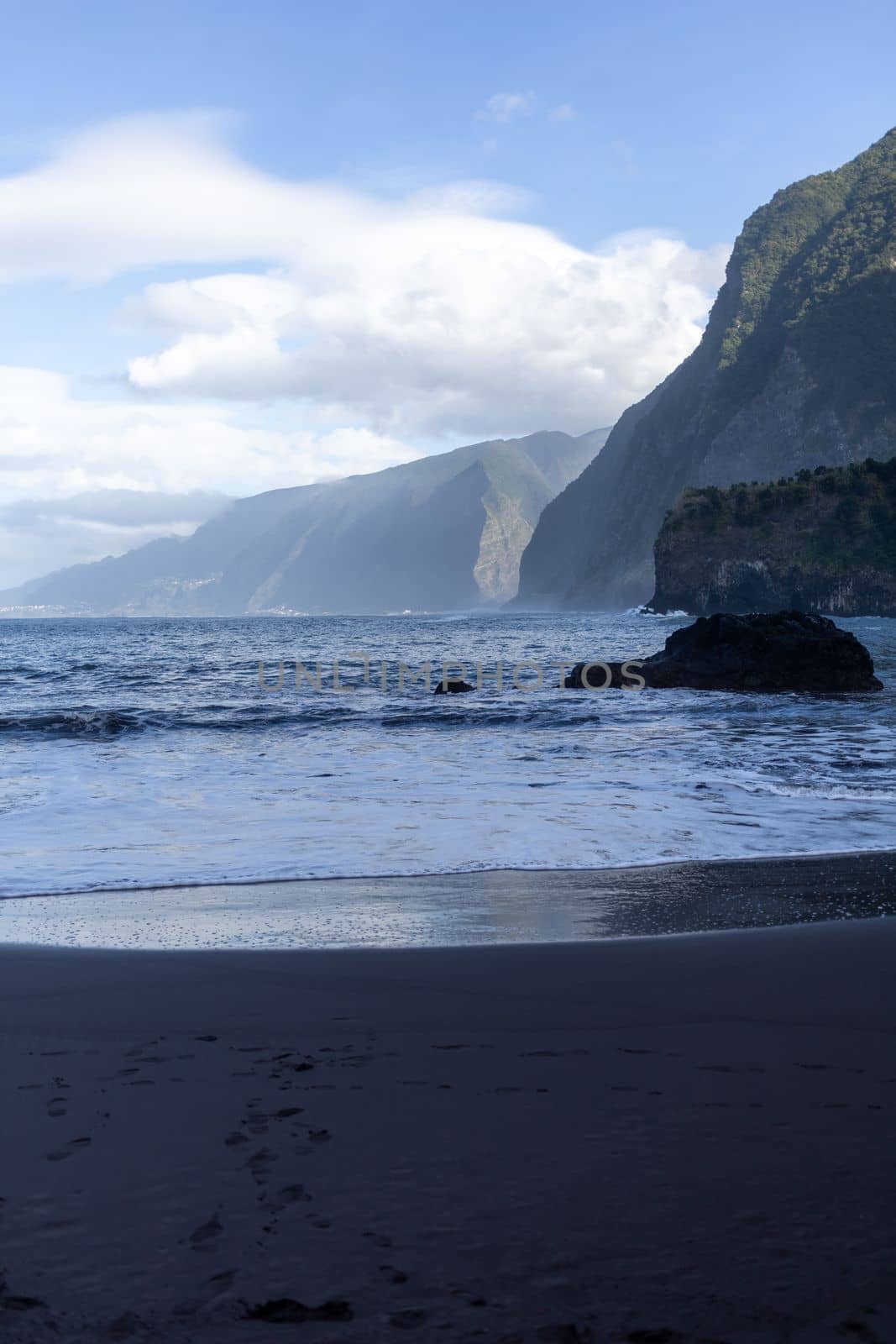 black sand beach of Madeira view on mountains. High quality photo