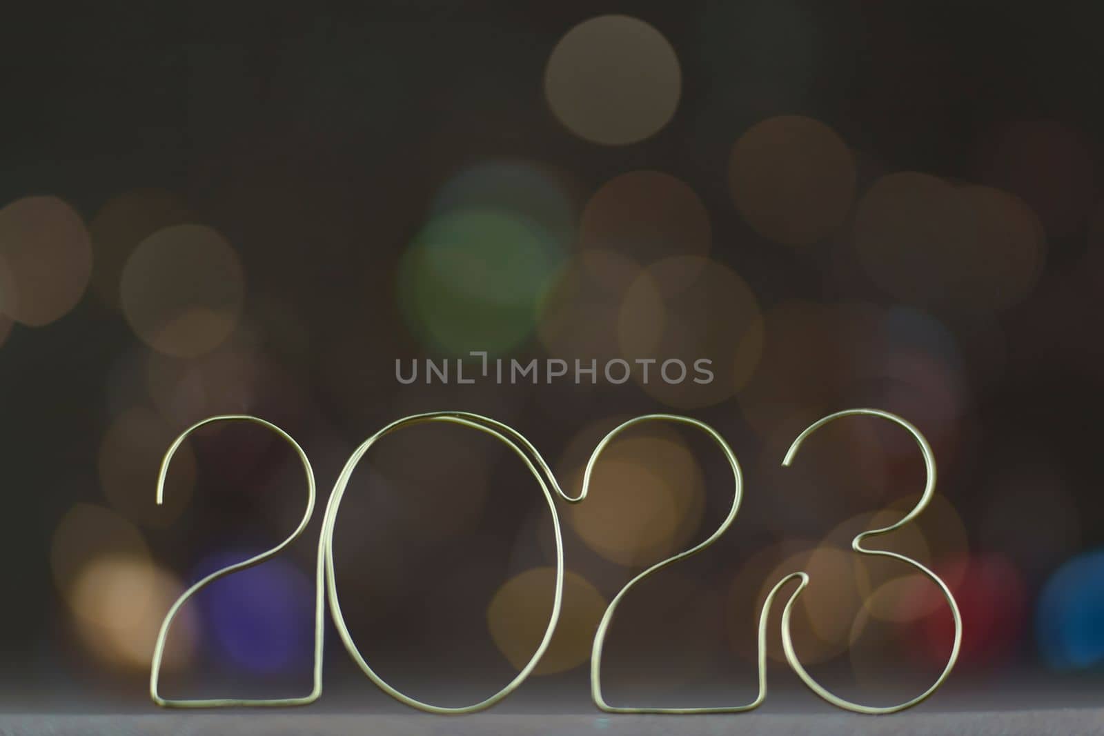 Happy New Year 2023. Beautiful holiday template web banner or billboard with Golden number 2023 on festive background with copy space for text. High quality photo