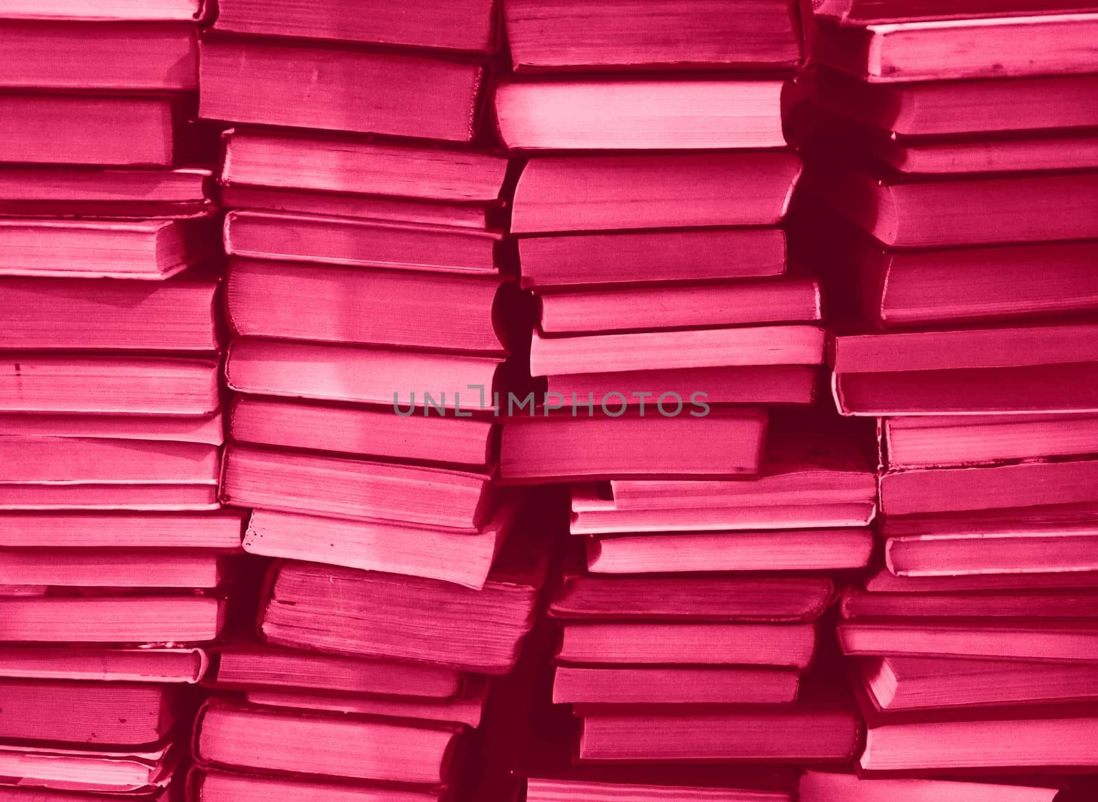 Viva Magenta colour chaotic stack of old books background. Background from old books that are exhibited in a chaotic manner. Colour of the year 2023. Trendy Viva Magenta color. by kizuneko