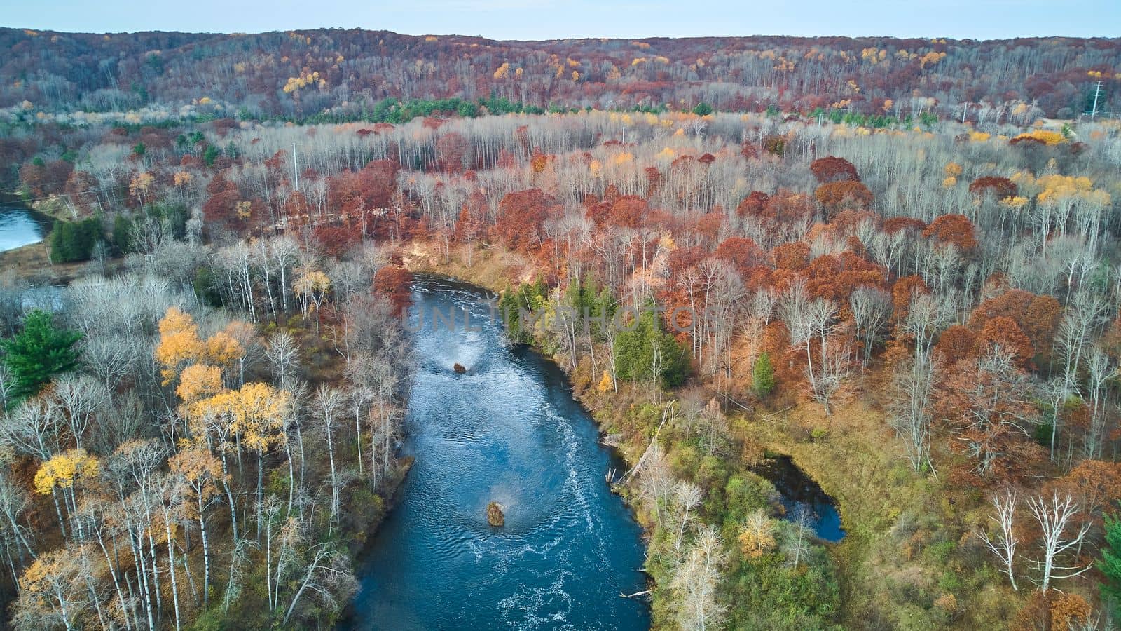 Image of Late fall Michigan river and forest from drone