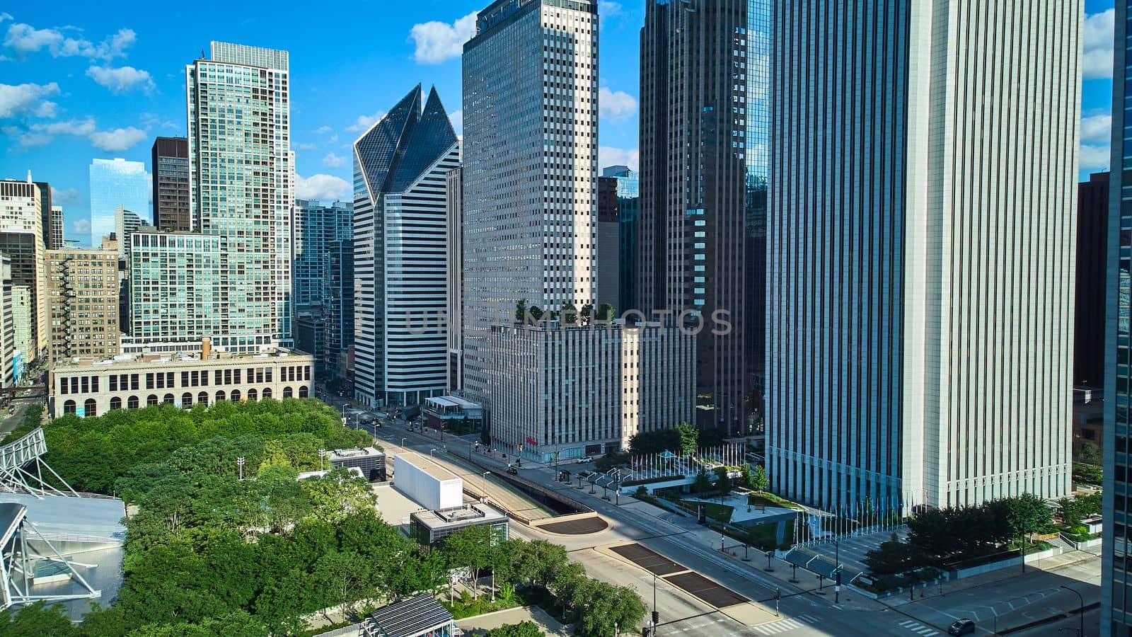 Looking over Millennium Park in downtown Chicago lined with skyscrapers by njproductions