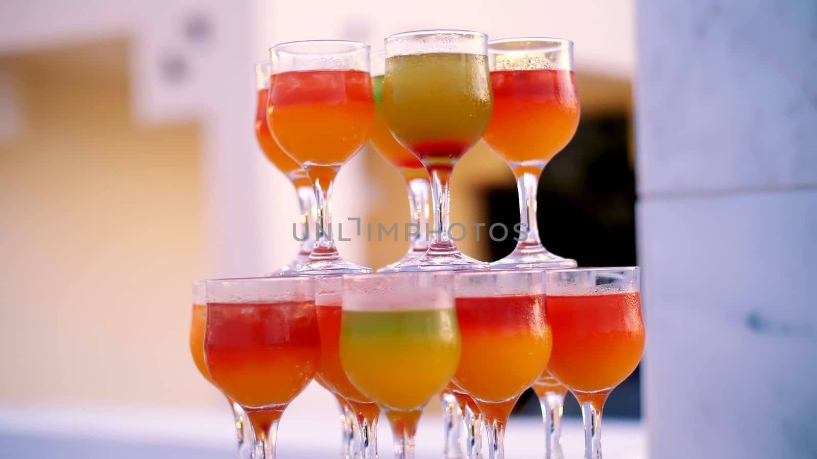 cocktail party, a design from colorful drinks, cocktails in glass glasses, original alcoholic and non-alcoholic cocktails. High quality photo
