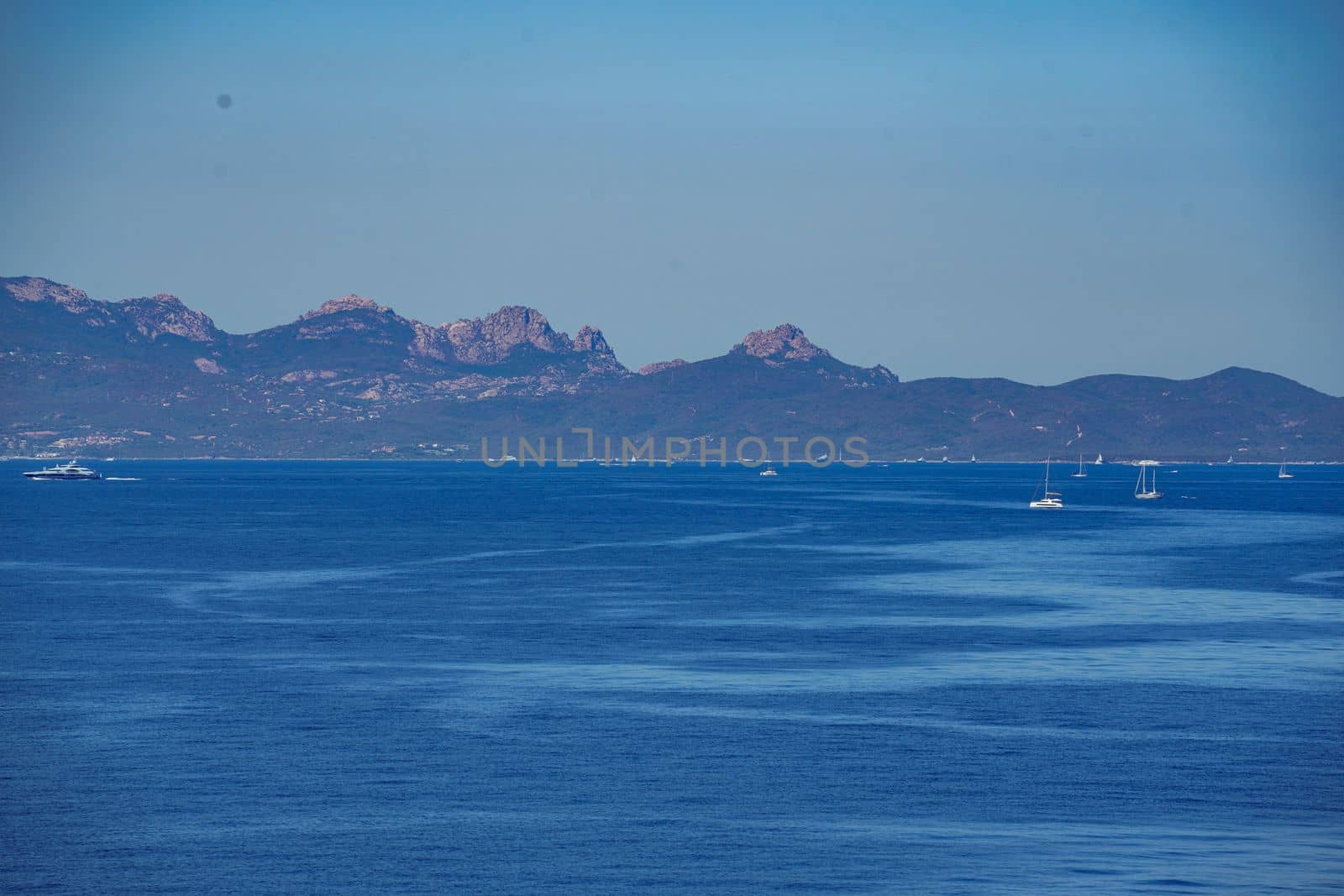 Amazing view from boat over clear sea water lagoon. Luxury travel, tropical blue turquoise Mediterranean panoramic seascape luxury white sailboat yacht. Beautiful exotic summer vacation leisure cruise. High quality photo