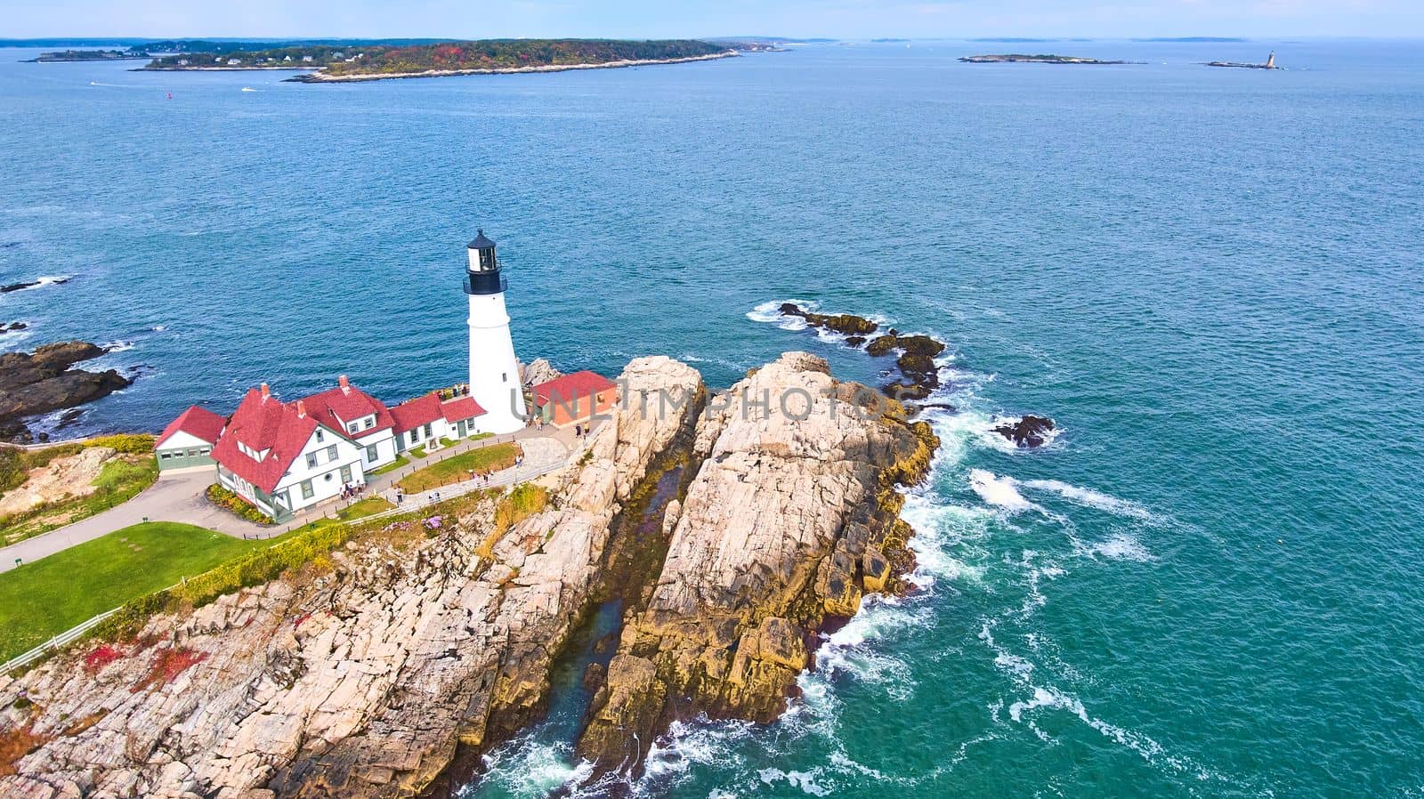 Image of Beautiful patch of Maine rocky coastline featuring Portland Head Light lighthouse