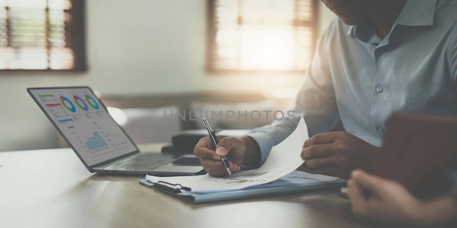 Financial analyst analyzes business people investment consultant analyzing company financial report working with documents graphs. Stock Market Tax Fund Finance concept. by itchaznong