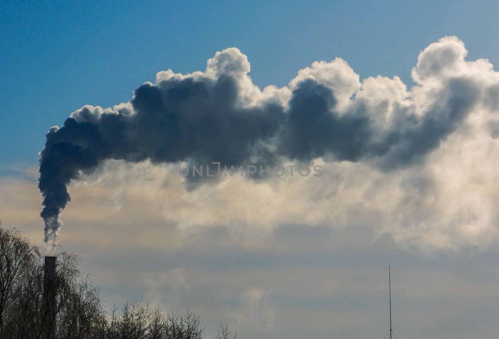 chimney winter snow, Smoking factory chimney, Smoke pollution of the environment.