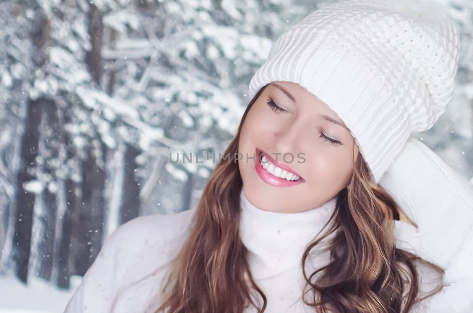 Winter holiday travel, lifestyle and fashion, beautiful happy woman and snowy forest, nature, ski resort and leisure activity outdoors Christmas, New Year and holidays portrait.