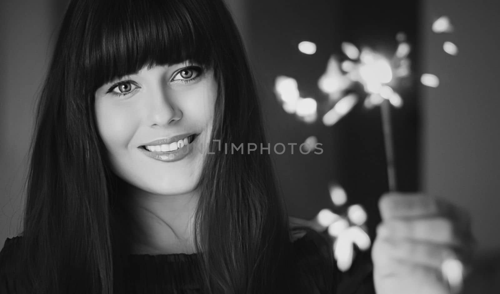 Holiday magic, Christmas and New Year celebration, happy woman with sparklers, portrait