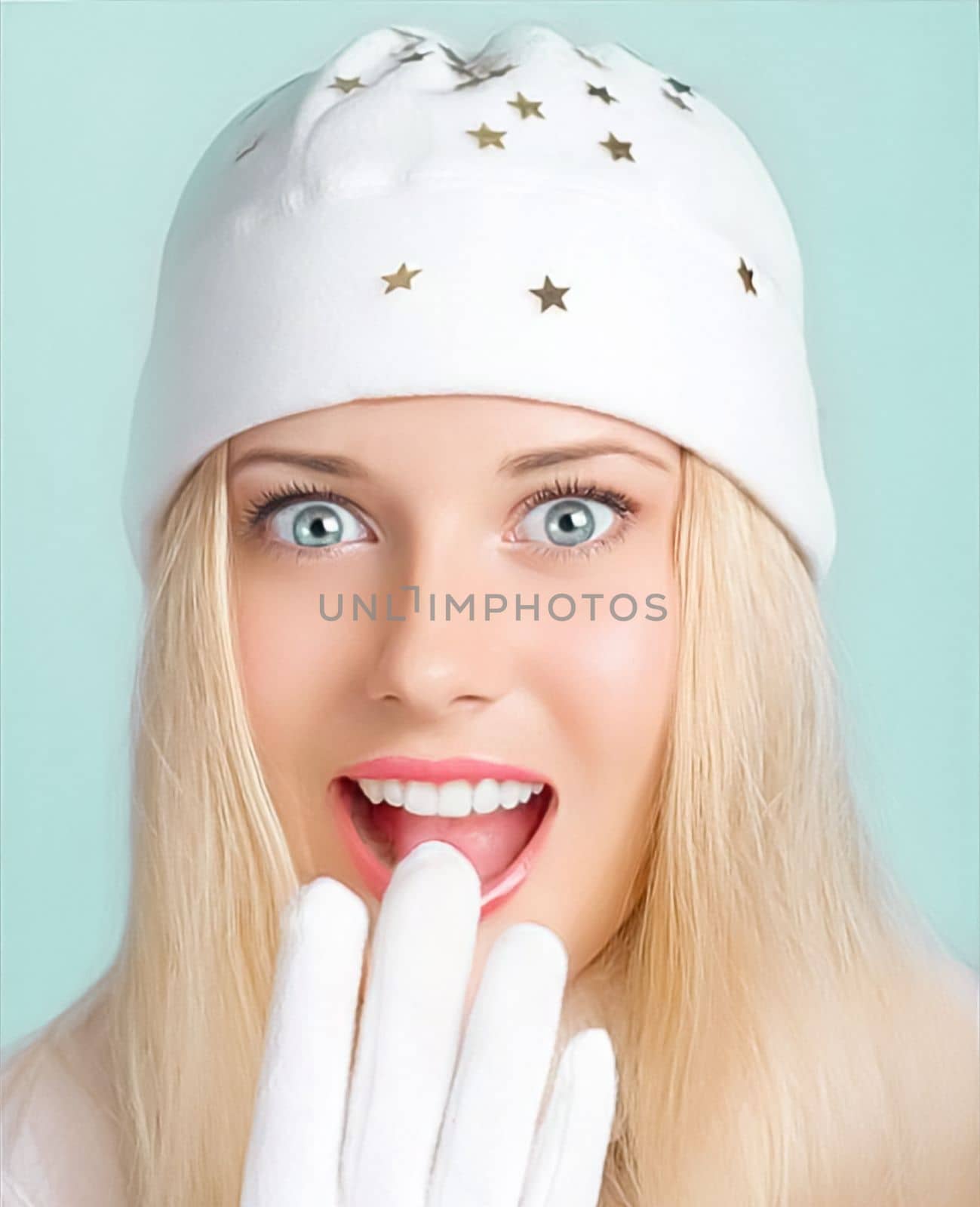 Merry Christmas, happy holidays and woman wearing white hat and gloves. Festive celebration, beauty and fashion female model on green background. Surprised funny blonde girl smiling and enjoying Christmas, New Year and winter holidays lifestyle by Anneleven