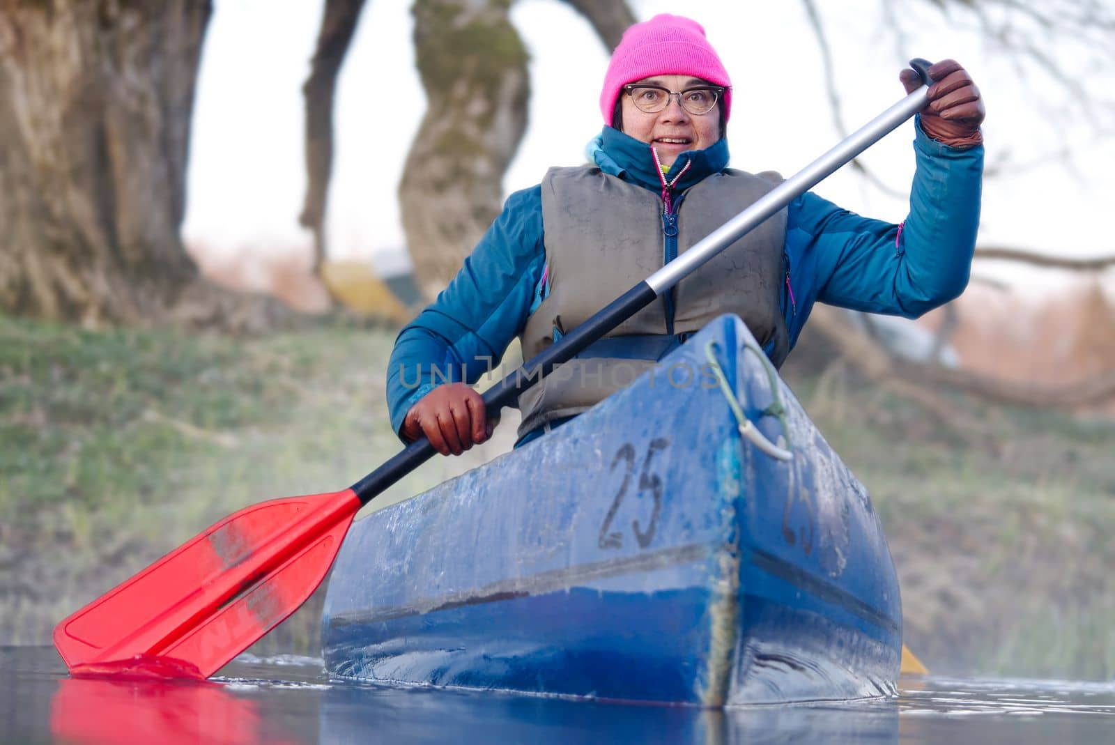 Seniors kayaking, activity. Happy senior. Active elderly concept around the world by PhotoTime