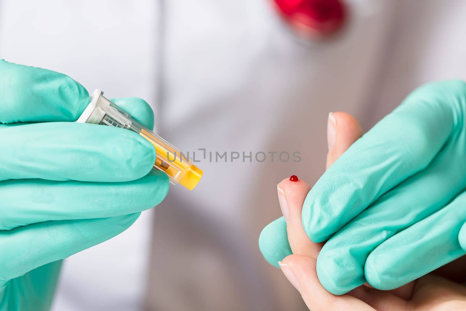 Doctor piercing patients finger with lancet in clinic closeup. Taking blood for close-up analysis, a clinical blood test. Finger prick