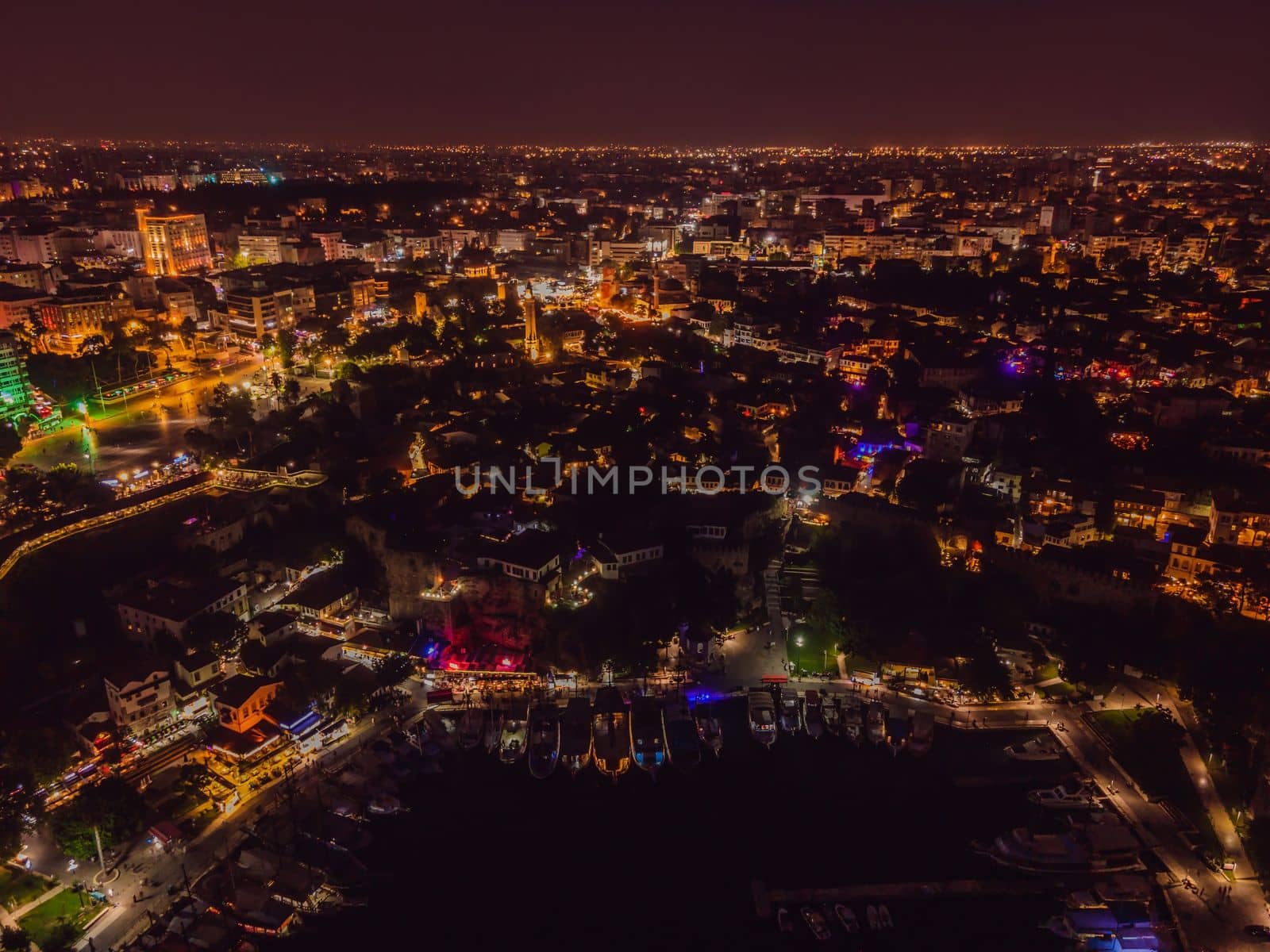 Night top aerial view of the old town Kaleici and old harbor in Antalya, Turkey. Turkey is a popular tourist destination by galitskaya