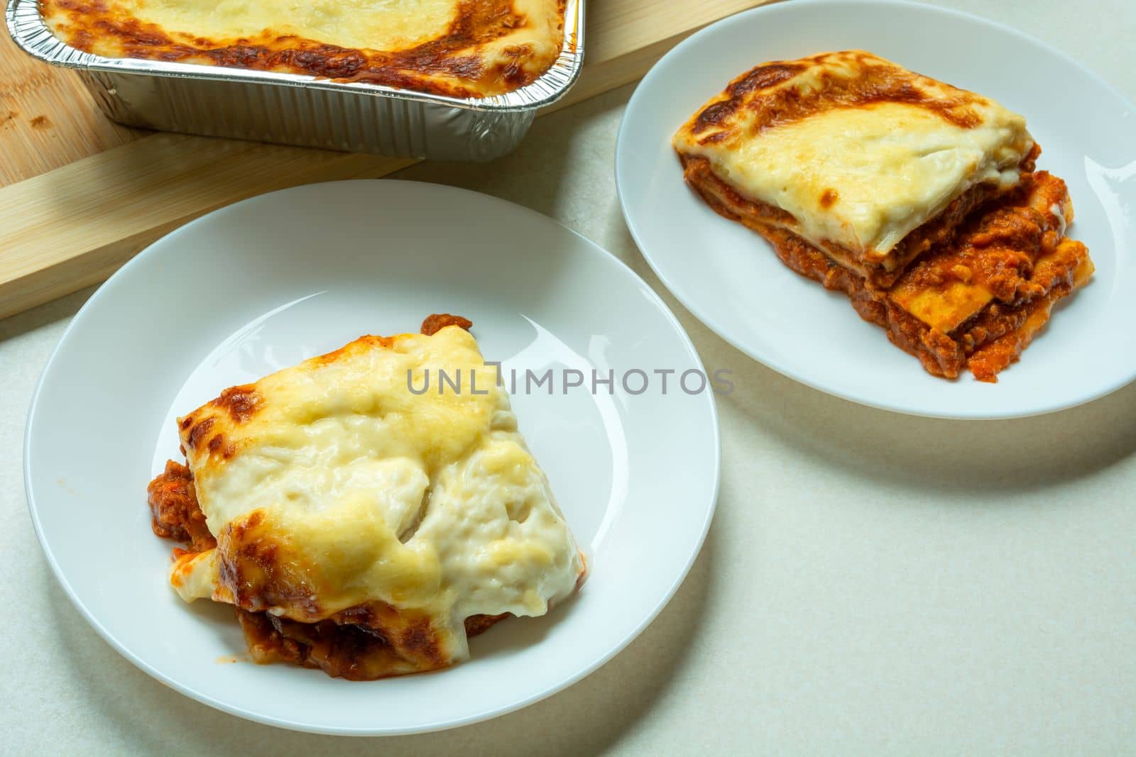 Two servings of fresh lasagne on a plate