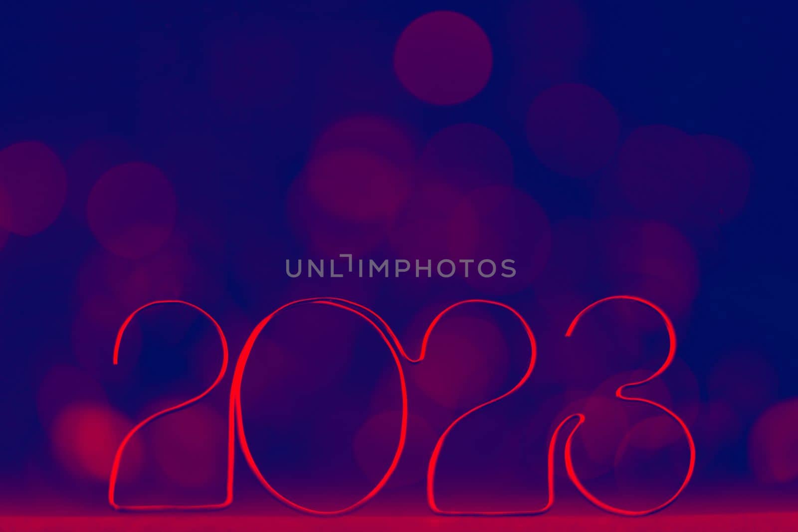 Happy New Year 2023. Beautiful web banner or billboard template with red number 2023 on blue background with copy space for text by Costin