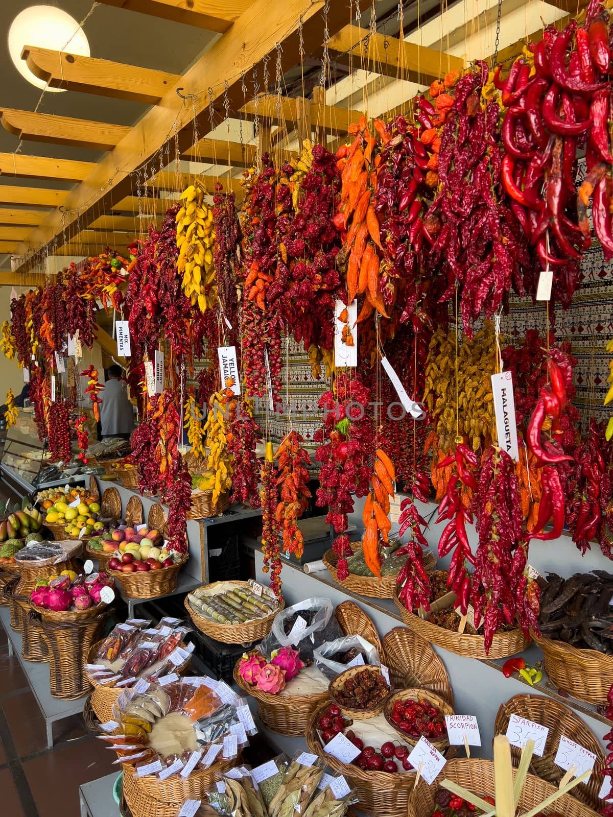 colorful red and orange peppers at the market mobile photo by Chechotkin