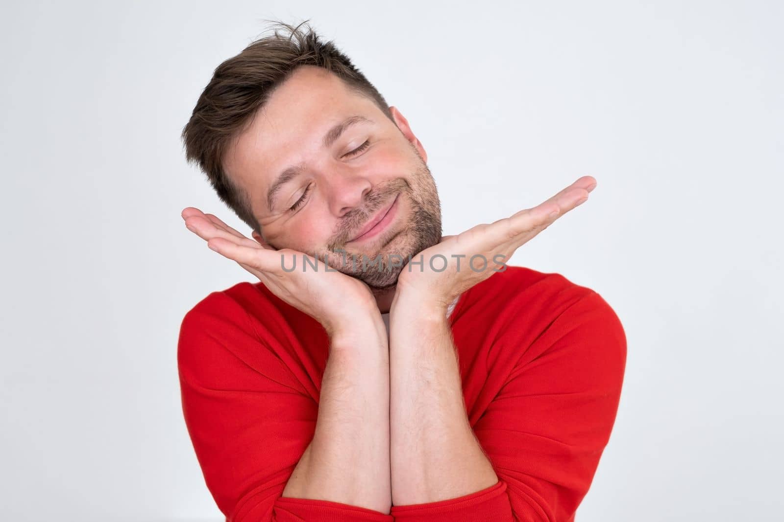 Confident young man looking away dreaming. Funny handsome guy hinking about the future. Closeup face of smiling casual man 