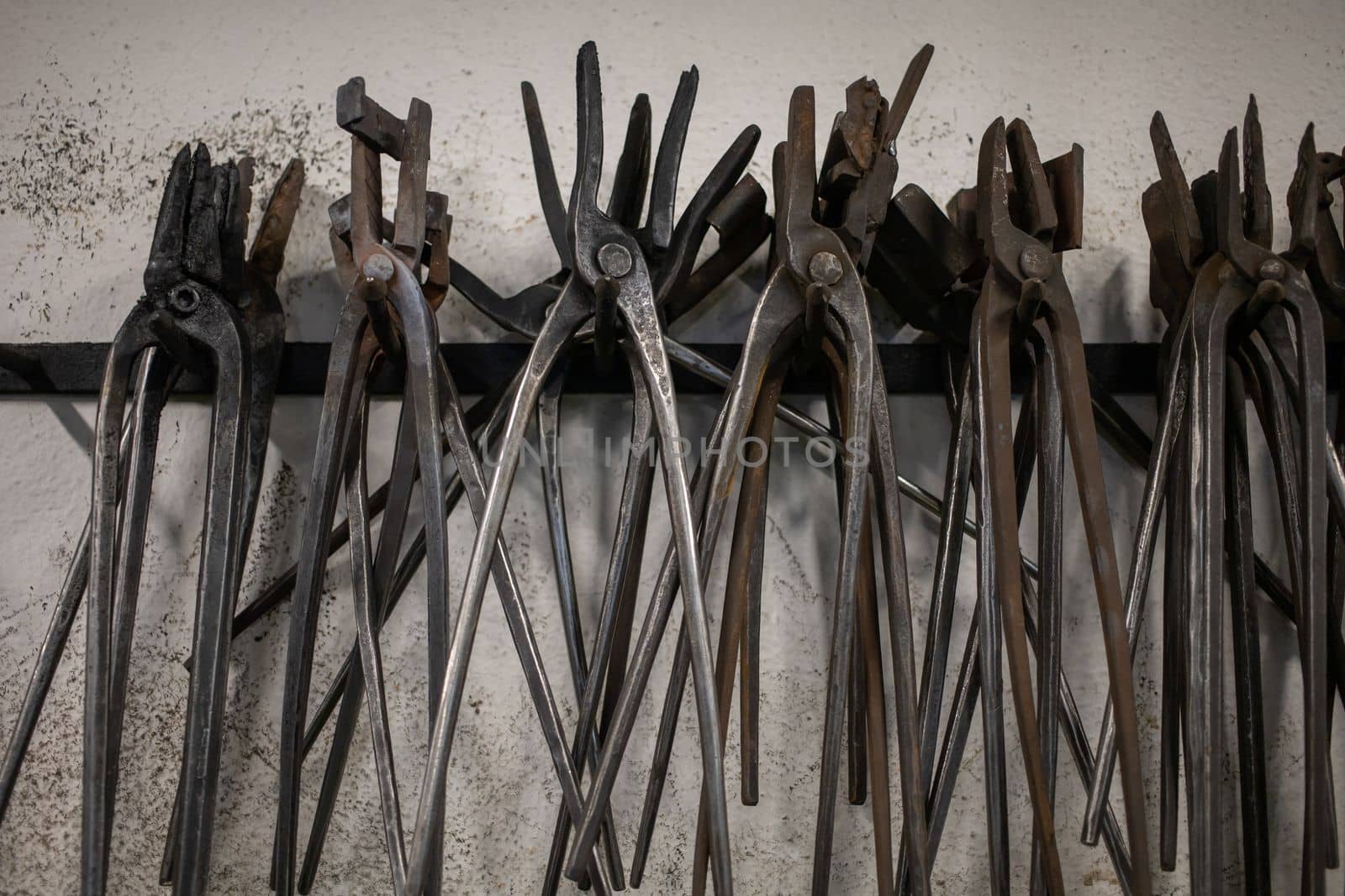 blacksmith tools and metal blanks in privet forge by Chechotkin